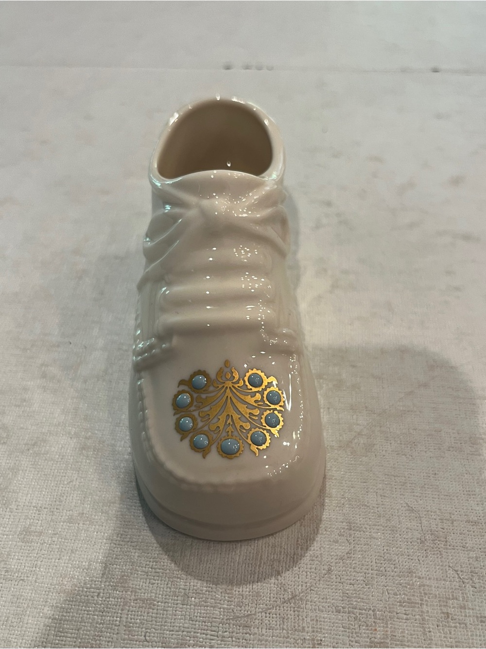 Vintage 1994 Lenox Cream Porcelain Baby Shoe with Gold and Light Blue accents.